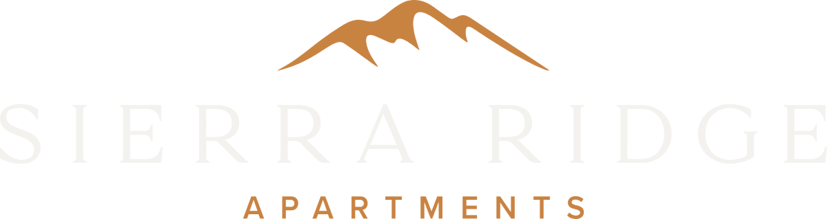a logo for spear ridge apartments with a mountain on it